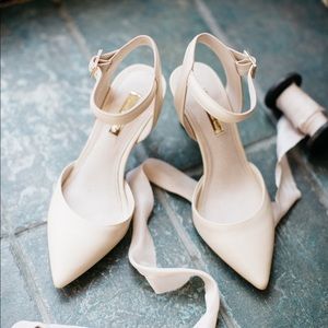 Closed toe cream heels with buckled ankle strap